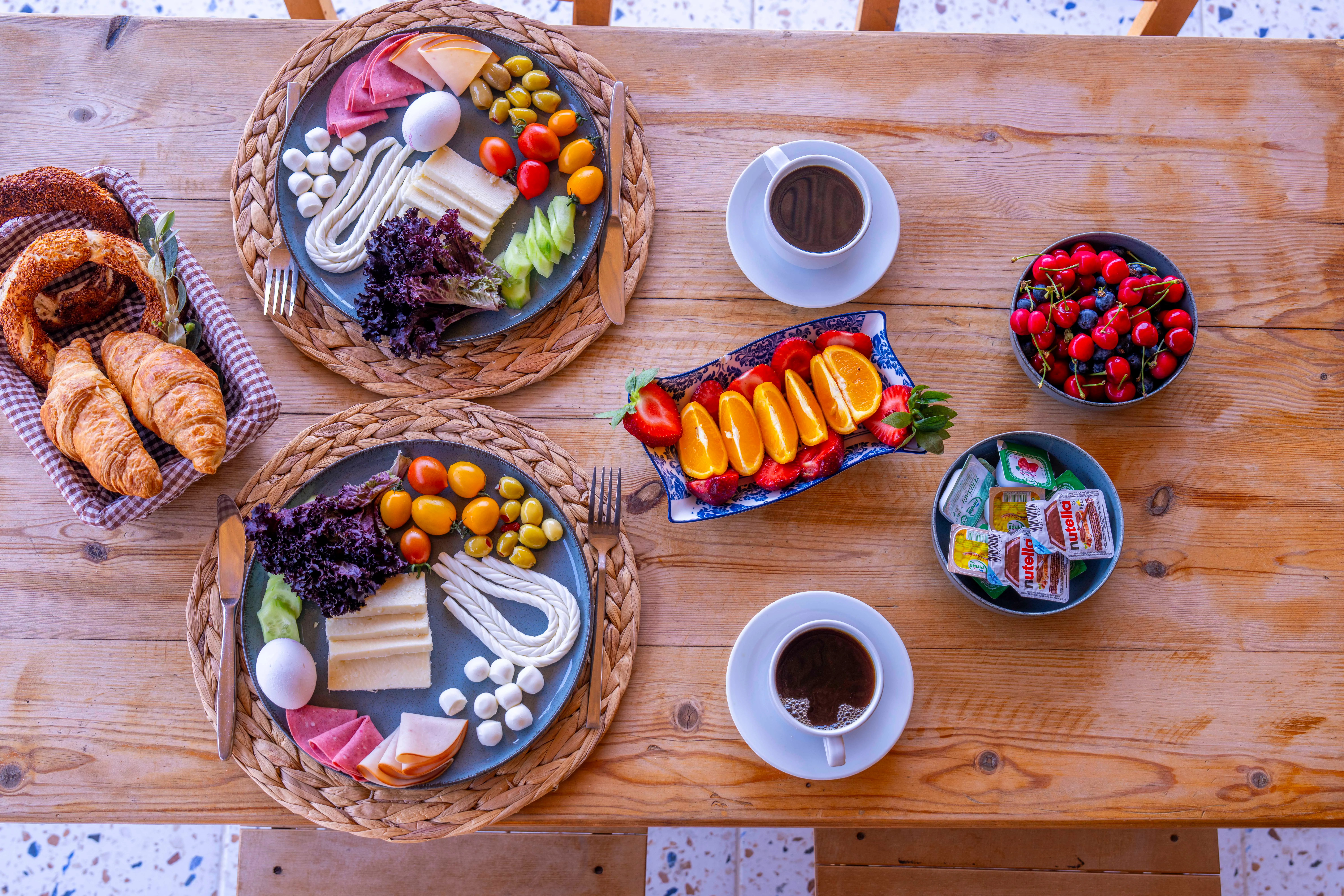 Homemade Turkish breakfast spread with fresh fruits and pastries