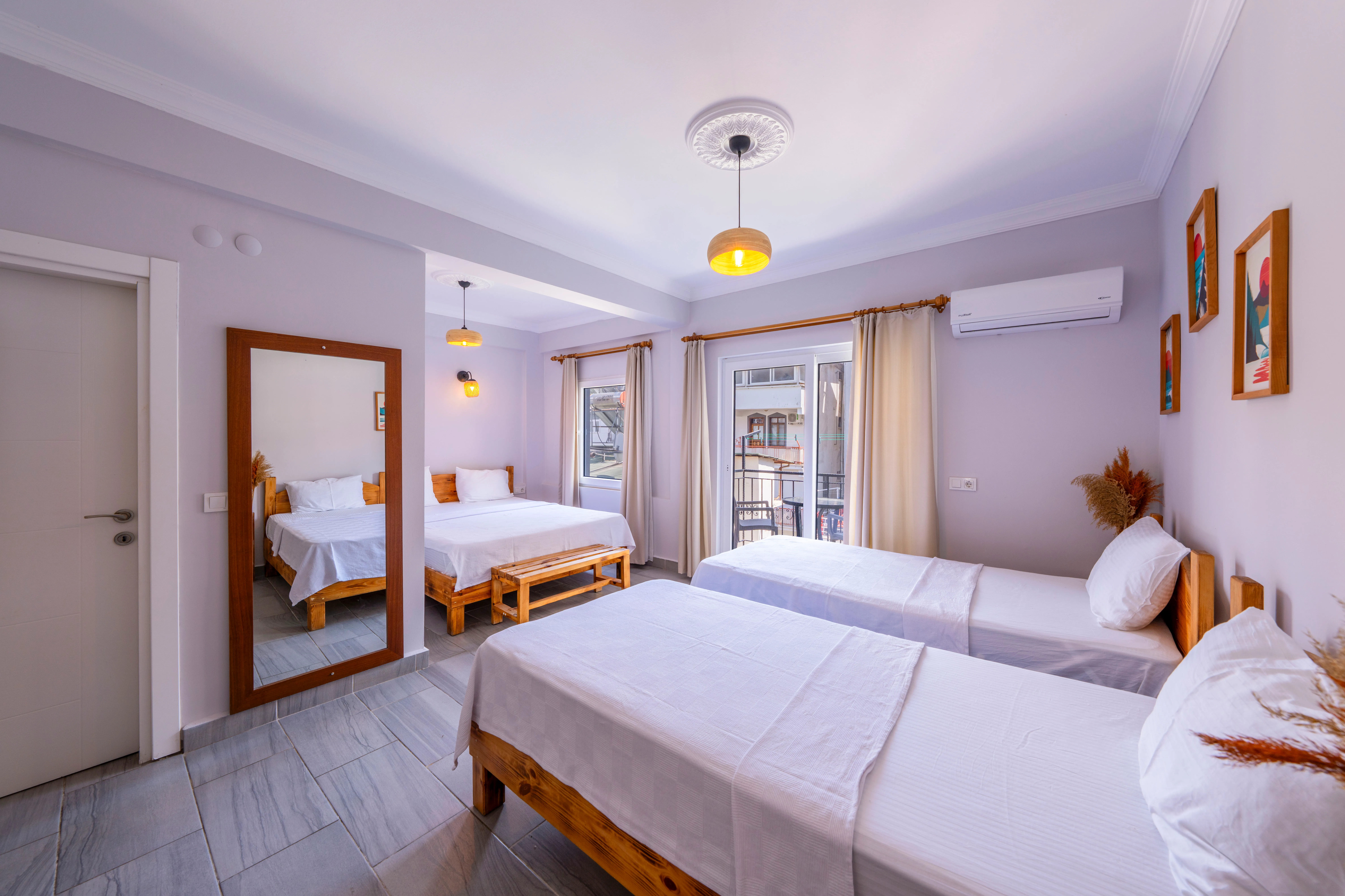 Family room with three beds at Larex Pansiyon Kaş